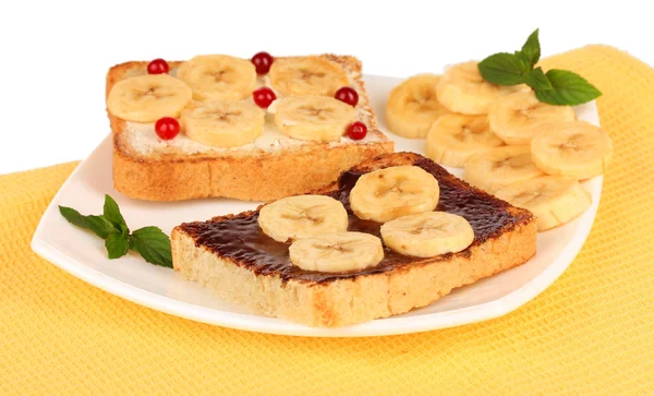 Delicious toast with bananas on plate close-up — Stock Photo, Image