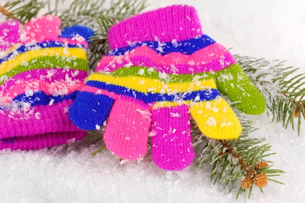 Children's mittens in snow — Stock Photo, Image