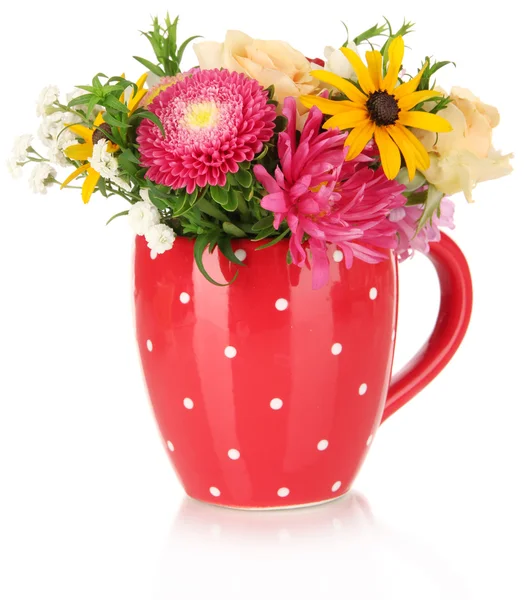 Beautiful bouquet of bright flowers in color mug, isolated on white — Stock Photo, Image