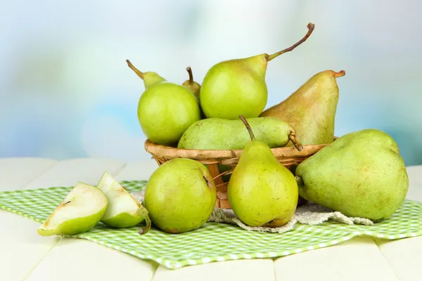 Pears in wicker basket, on light background — Stock Photo, Image