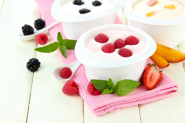 Delicious yogurt with fruit and berries on table close-up Stock Photo