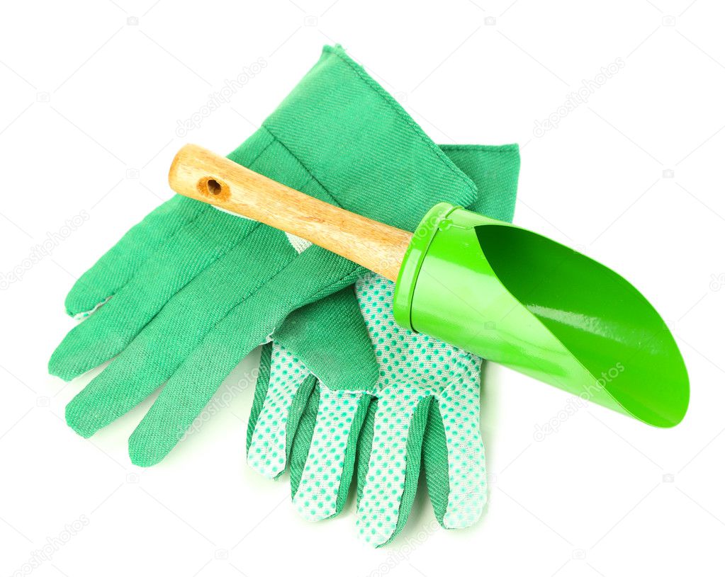 Small gardening shovel and gloves isolated on white