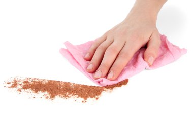 Hand wiping surface with pink rag isolated on white clipart
