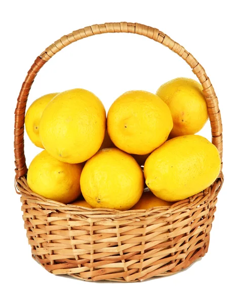 Ripe lemons in wicker basket isolated on white — Stock Photo, Image