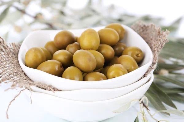 Olives in bowl with branch close up — Stock Photo, Image