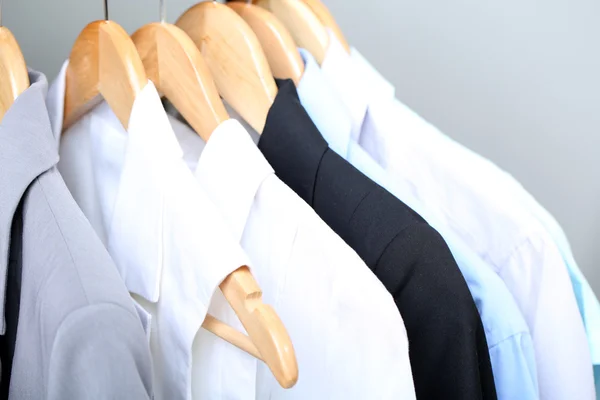 Clothes on circle hanger on light background — Stock Photo, Image