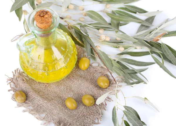 Olive oil and branch on sackcloth close up — Stock Photo, Image