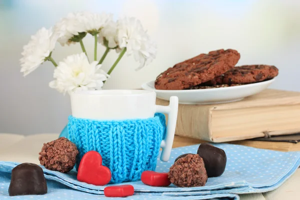 Cup with knitted thing on it close up — Stock Photo, Image