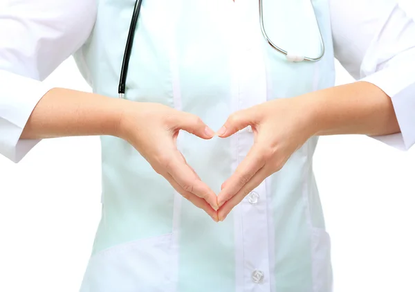 Zamknąć w ręce lekarza co kształt serca, na białym tle biały — Zdjęcie stockowe