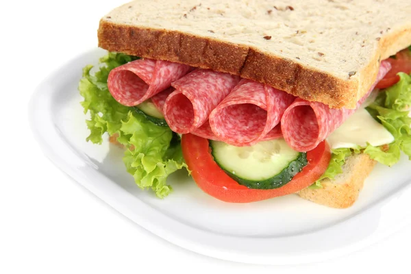 Tasty sandwich with salami sausage and vegetables on white plate, isolated on white — Stock Photo, Image