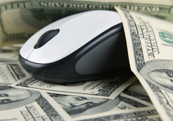 Computer mouse on dollars close up — Stock Photo, Image