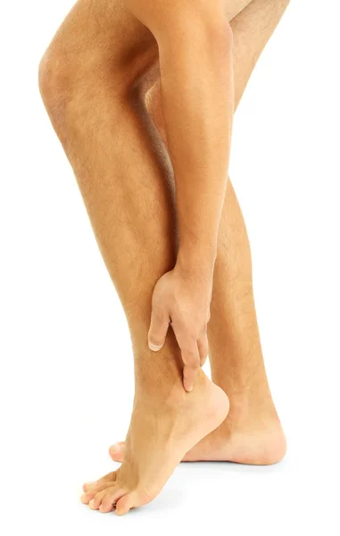 Νεαρός άνδρας με πόδι πόνος, που απομονώνονται σε λευκό — Φωτογραφία Αρχείου