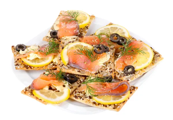 Sandwiches de salmón en plato aislado sobre blanco —  Fotos de Stock