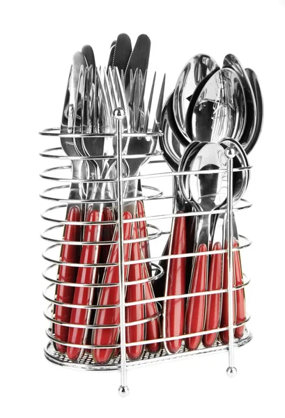 Nože, vidličky a lžíce v kovový stojan izolovaných na bílém — Stock fotografie