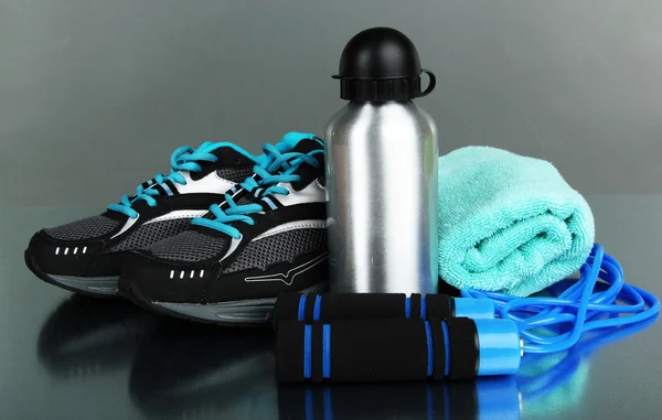 Different tools for sport on grey background — Stock Photo, Image