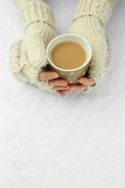 Female hands with hit drink, on light background — Stock Photo, Image