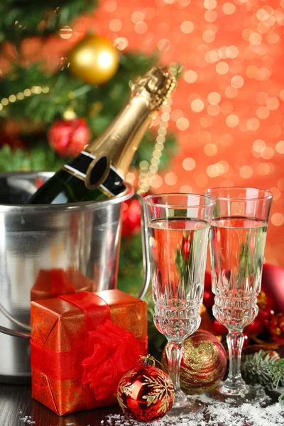 Composition with Christmas decorations and two champagne glasses, on bright background — Stock Photo, Image