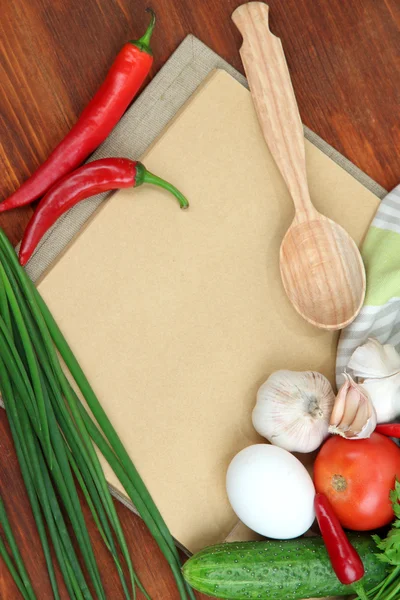 Cooking concept. Groceries with empty cookbook close up — Stock Photo, Image