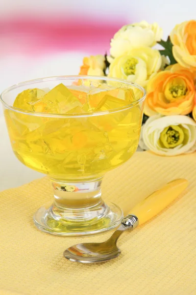 Tasty jelly cubes in bowl on table on light background — Stock Photo, Image