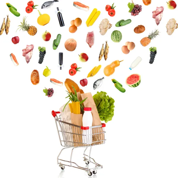 Food products flying out of shopping cart isolated on white — Stock Photo, Image