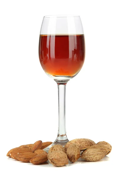 Glass of amaretto liquor and roasted almonds, isolated on white — Stock Photo, Image