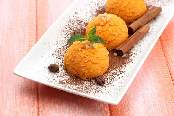 Delicious ice cream on plate on table close-up — Stock Photo, Image