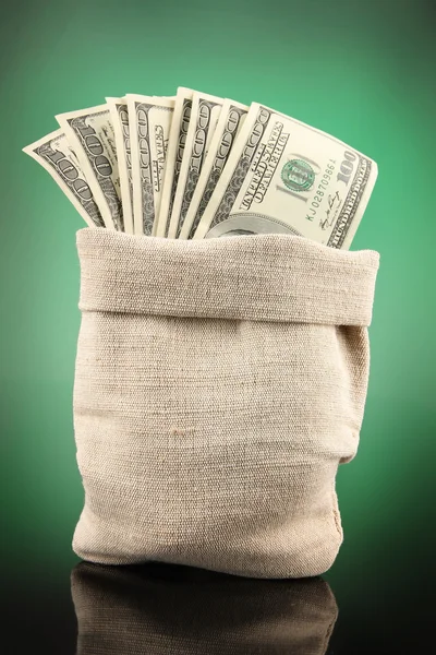 Money in bag on dark color background — Stock Photo, Image