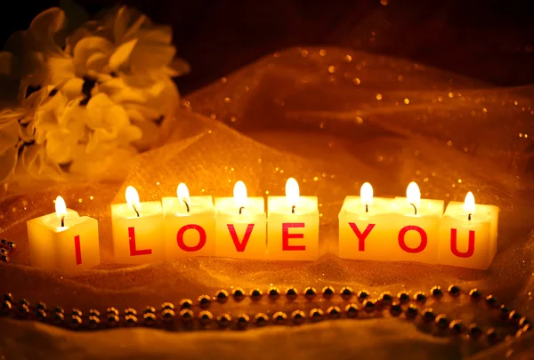 Candles with printed sign I LOVE YOU,on dark background — Stock Photo, Image