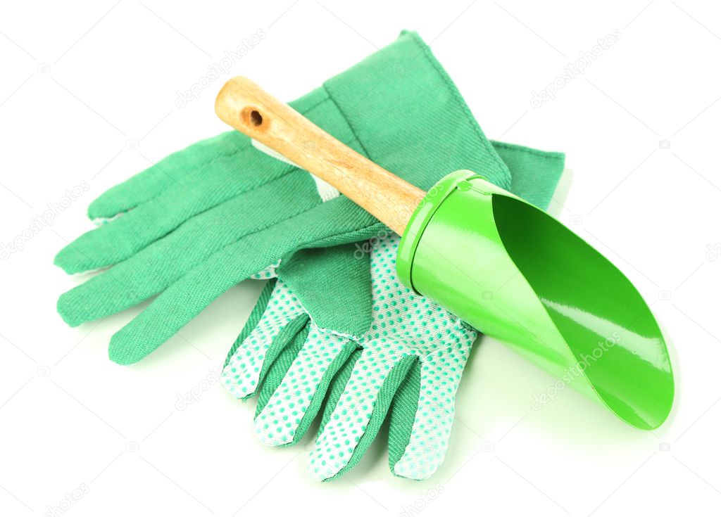 Small gardening shovel and gloves isolated on white