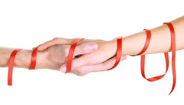 Мужские и женские руки связаны лентой, изолированной на белом — стоковое фото