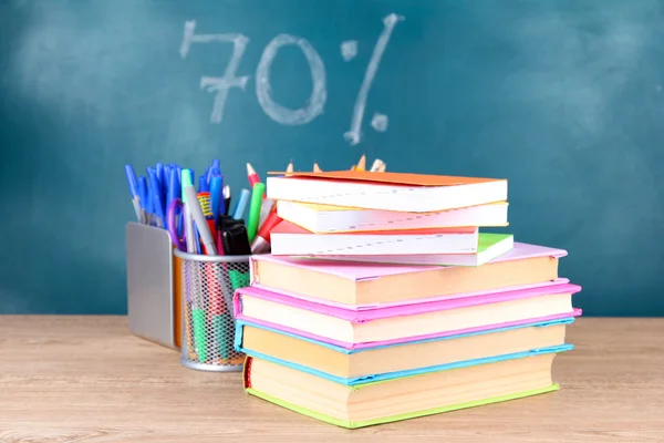 Office supplies on table on school board background — Stock Photo, Image