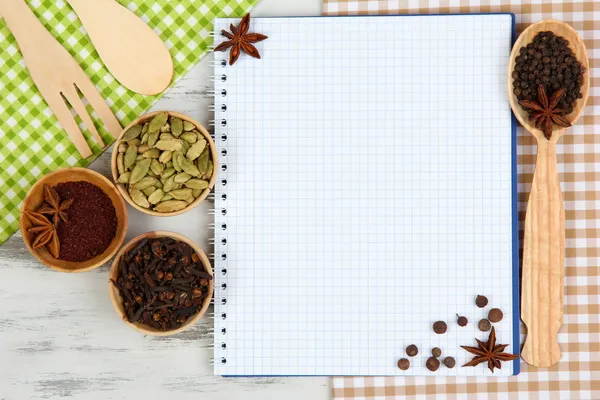 Various spices and herbs with empty white blank for recipe — Stock Photo, Image