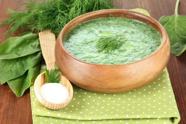 Tasty spinach soup, on wooden table — Stock Photo, Image