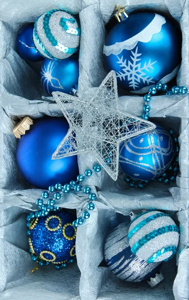 Christmas toys in wooden box close-up — Stock Photo, Image