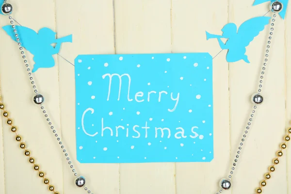 Signboard with words Merry Christmas on wooden table background close-up — Stock Photo, Image