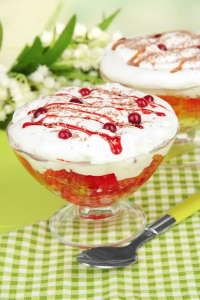 Tasty jelly in bowls on table on light background — Stock Photo, Image