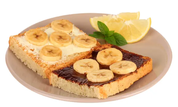 Delicious toast with bananas on plate isolated on white — Stock Photo, Image