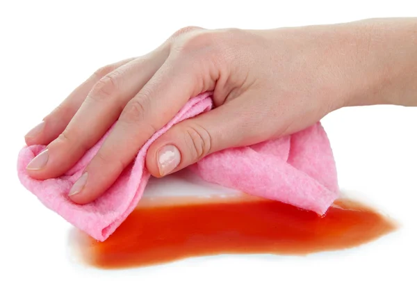 ピンクの布を白で隔離される表面を拭く手 — ストック写真