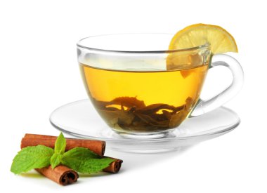 Transparent cup of green tea with cinnamon and mint isolated on white clipart