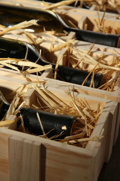 Wooden case with wine bottles close up — Stock Photo, Image