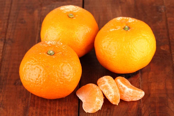 Tasty mandarines on wooden background — Stock Photo, Image