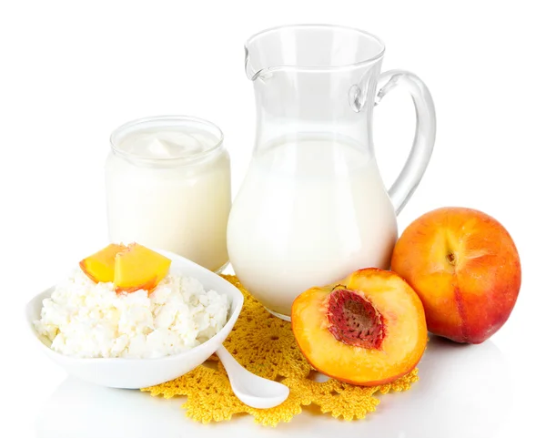 Fresh dairy products with peaches isolated on white — Stock Photo, Image