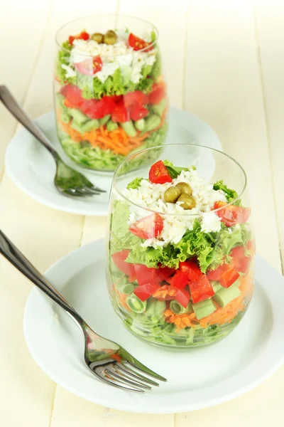 Tasty salad with fresh vegetables on wooden table — Stock Photo, Image