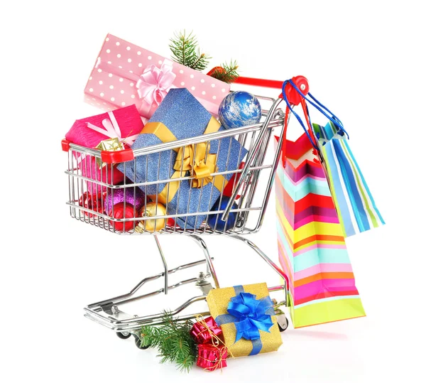 Christmas gifts in shopping trolley, isolated on white — Stock Photo, Image