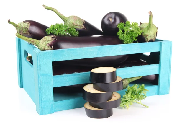 Fresh eggplants in wooden box isolated on white — Stock Photo, Image