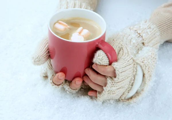 Female hands with hit drink, on light background — Stock Photo, Image