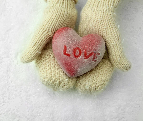 Female hands in mittens with red heart, close-up — Stock Photo, Image