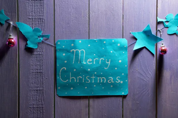 Signboard with words Merry Christmas on wooden table background close-up — Stock Photo, Image