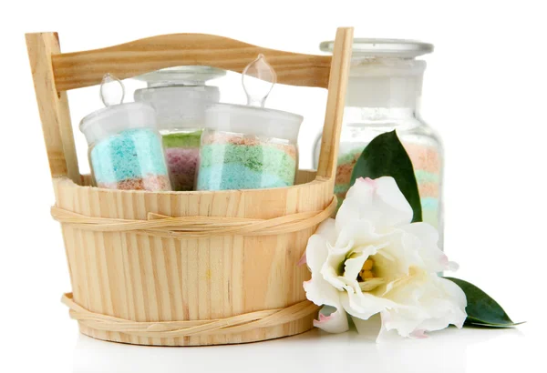 Aromatic salts in glass bottles, in wooden bucket, isolated on white — Stock Photo, Image