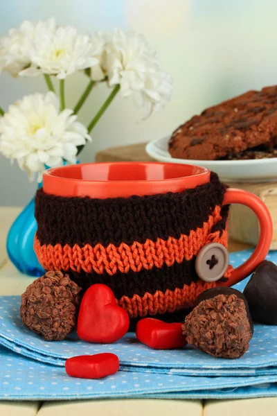 Cup with knitted thing on it close up — Stock Photo, Image